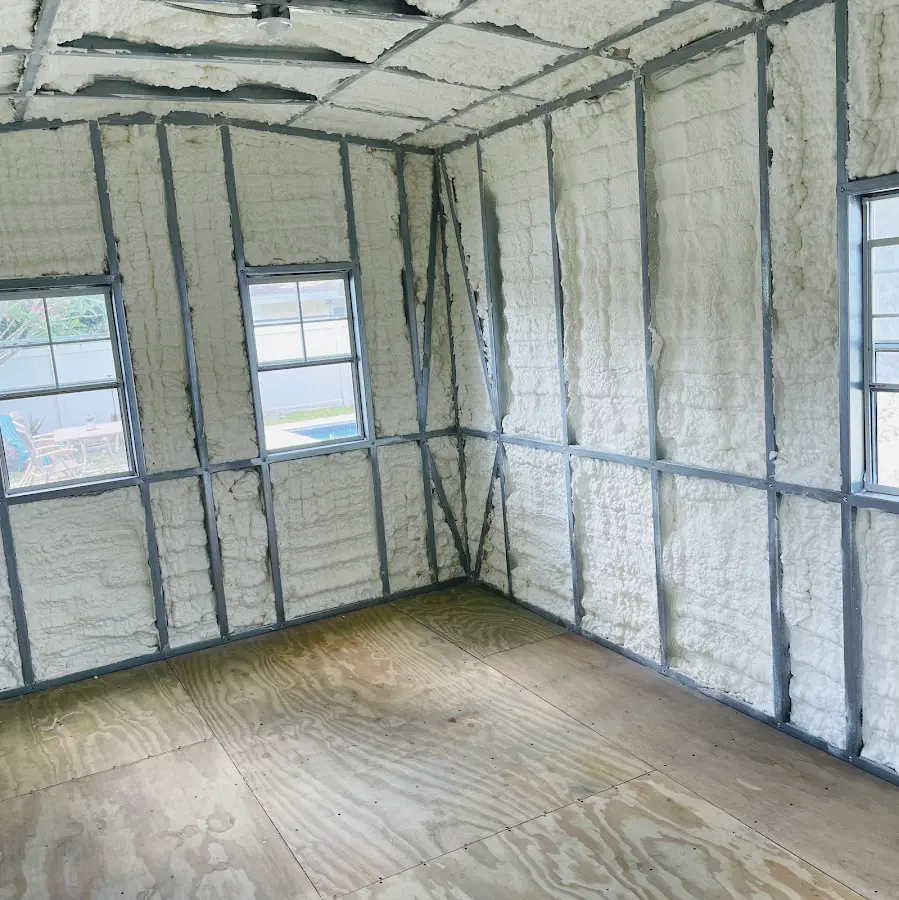 Closed-cell spray foam insulation applied to wall cavities in a residential project in Peterborough